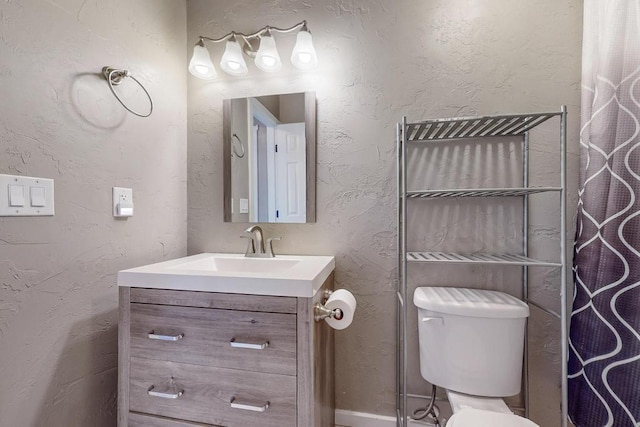 1139 Forrester Ave NW, Albuquerque, NM 87104 - full bathroom with toilet and vanity