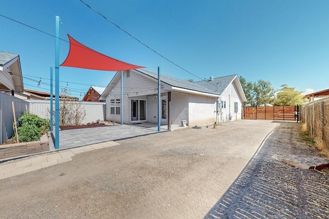 1139 Forrester Ave NW, Albuquerque, NM 87104 - rear view of house featuring a fenced backyard and a patio area
