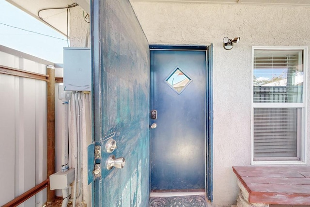 1139 Forrester Ave NW, Albuquerque, NM 87104 - view of exterior entry featuring stucco siding