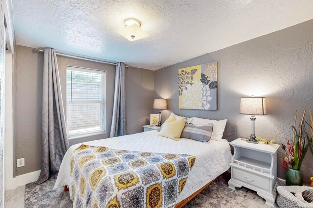 bedroom featuring a textured ceiling