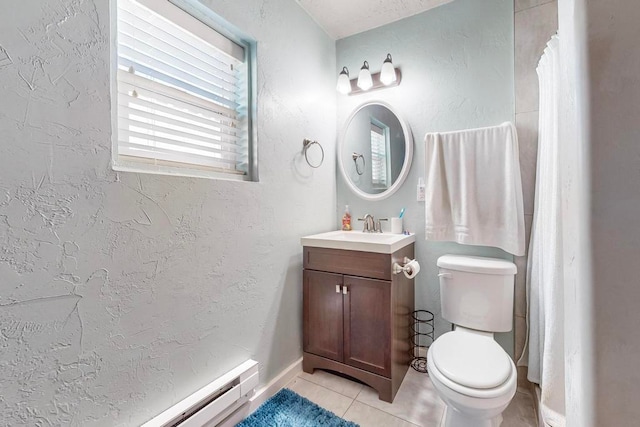 bathroom featuring vanity, baseboard heating, tile patterned flooring, and toilet