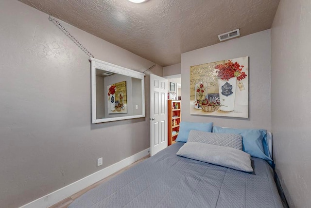 bedroom featuring a textured ceiling