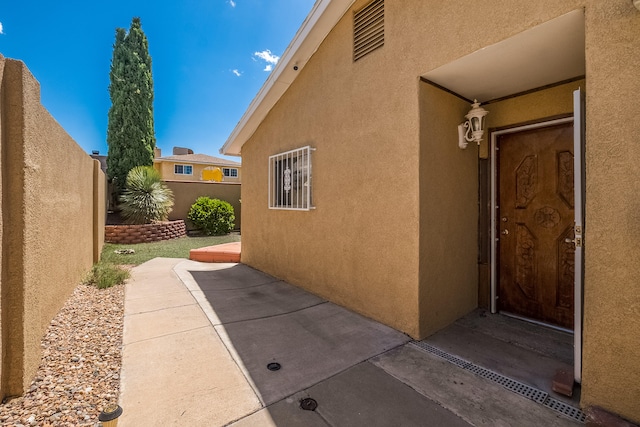 view of side of home with a patio area