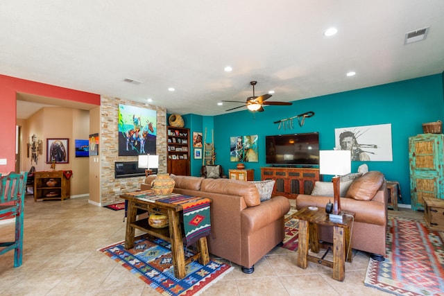 tiled living room with recessed lighting, visible vents, and a fireplace