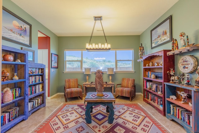living area featuring tile patterned floors and baseboards