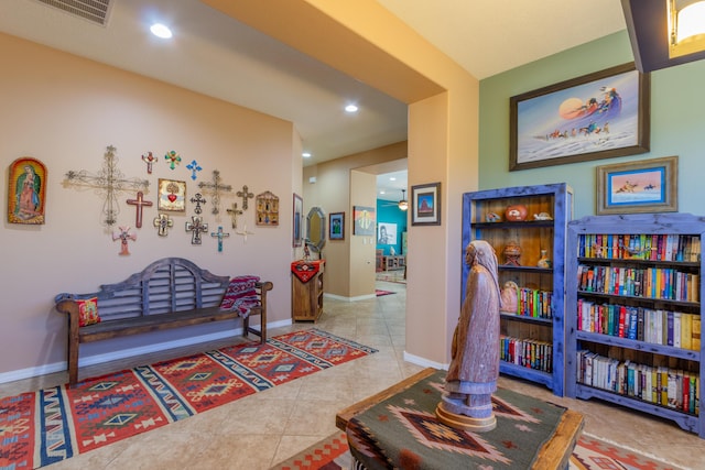 hallway with recessed lighting, tile patterned flooring, visible vents, and baseboards