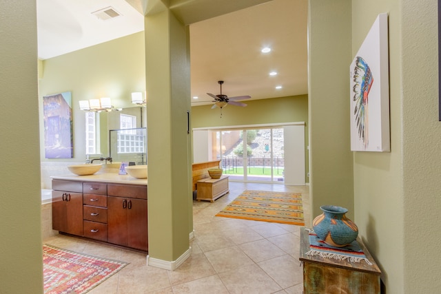 interior space with vanity, ceiling fan, and tile patterned flooring