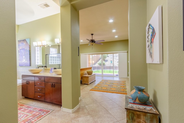 full bath featuring a sink, tile patterned flooring, visible vents, and a ceiling fan