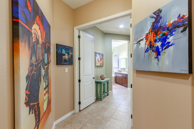 hallway featuring light tile patterned floors