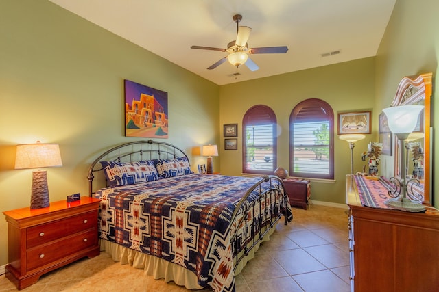 tiled bedroom featuring visible vents, ceiling fan, and baseboards
