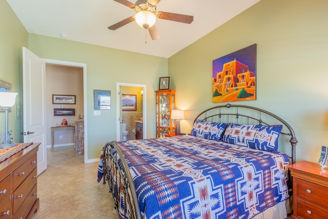 tiled bedroom with ensuite bathroom and ceiling fan