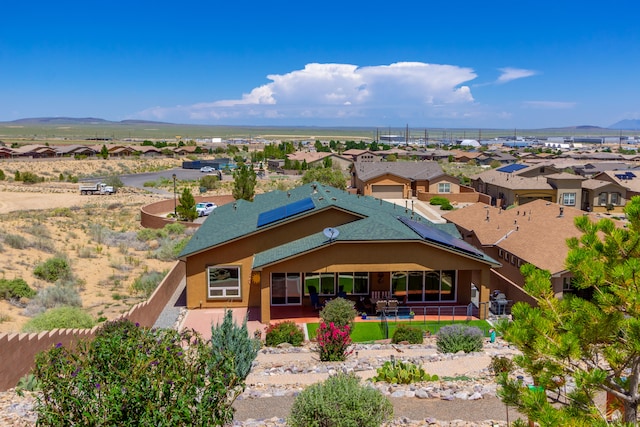 birds eye view of property featuring a mountain view