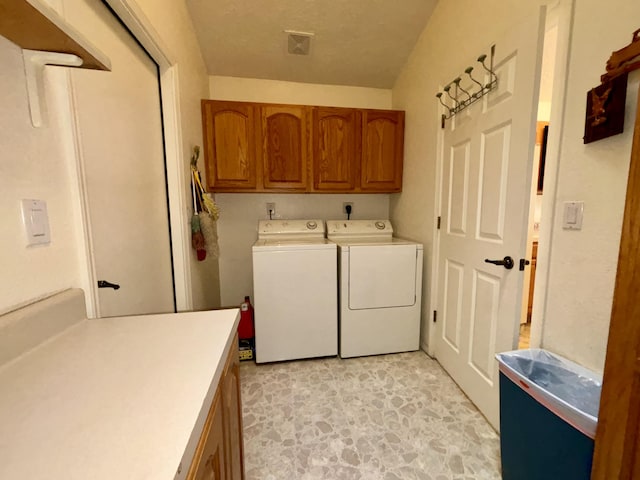 washroom with cabinets and separate washer and dryer