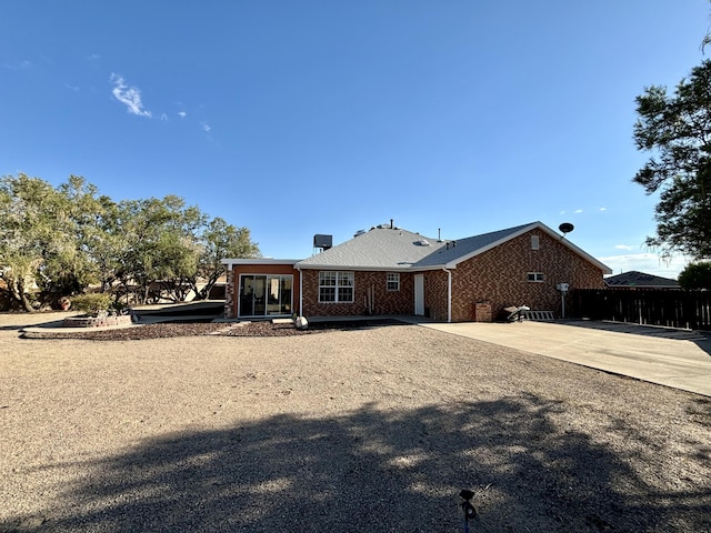 back of house with a patio area