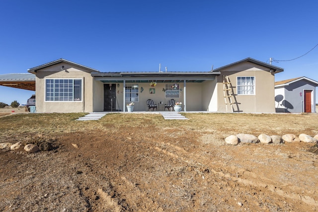 rear view of house with a patio area