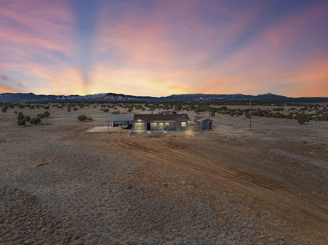 view of front of property featuring a mountain view and a rural view