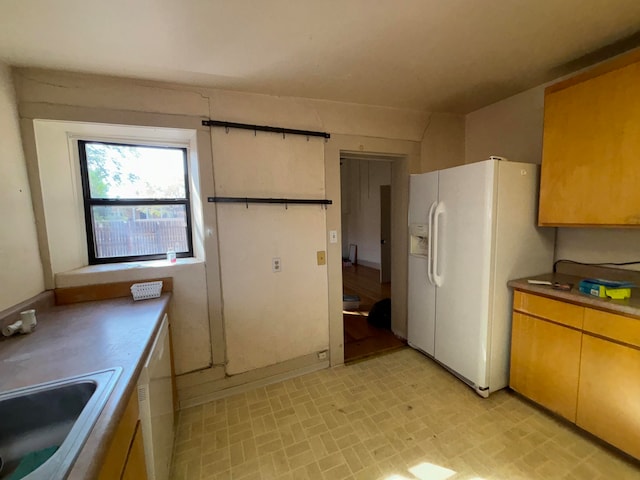 kitchen with white appliances and sink