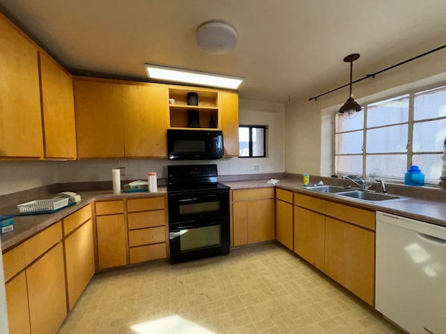 kitchen featuring black appliances and sink