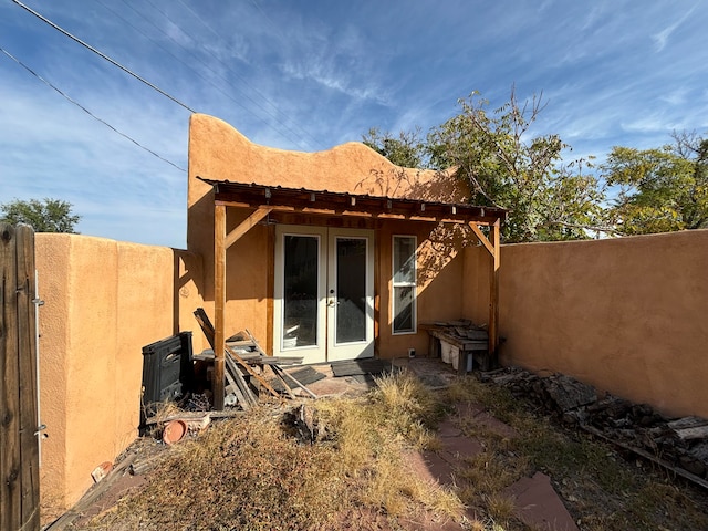 rear view of property featuring french doors