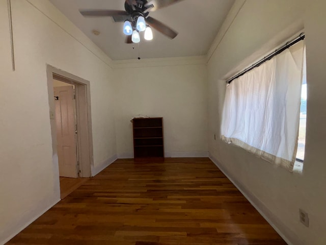 unfurnished room featuring ceiling fan and dark hardwood / wood-style flooring