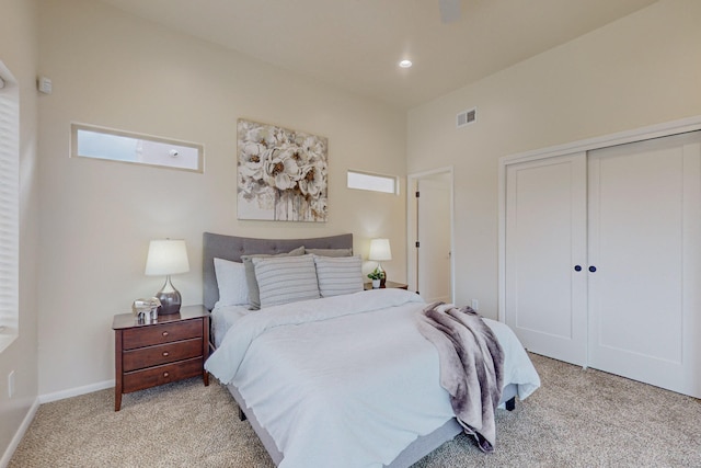 carpeted bedroom featuring a closet