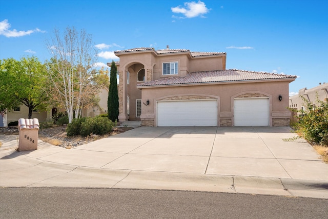 mediterranean / spanish-style house featuring a garage