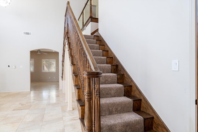 stairway with a towering ceiling