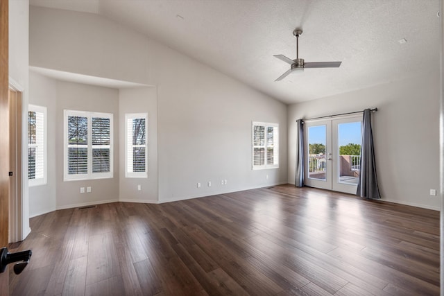 spare room featuring ceiling fan, french doors, dark wood-type flooring, high vaulted ceiling, and a textured ceiling