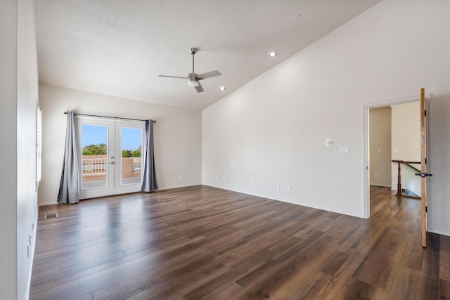 unfurnished room with ceiling fan, french doors, high vaulted ceiling, and dark wood-type flooring