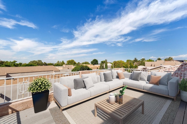 wooden terrace featuring an outdoor hangout area