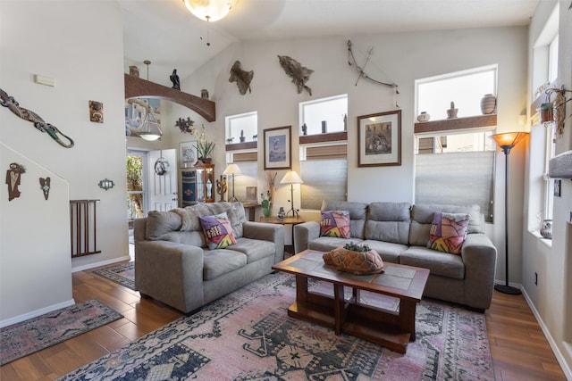 living room featuring high vaulted ceiling, dark wood-type flooring, and ceiling fan