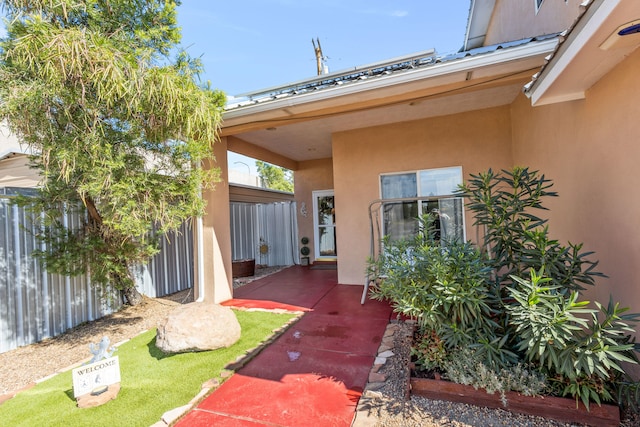 entrance to property with a patio