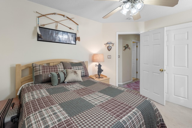 bedroom with a closet, ceiling fan, and carpet