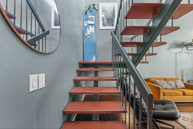 staircase featuring hardwood / wood-style floors