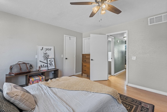 bedroom featuring light hardwood / wood-style flooring and ceiling fan