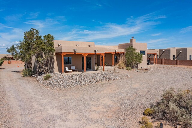 rear view of house featuring a patio area