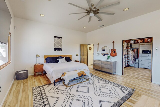 bedroom featuring ceiling fan and light hardwood / wood-style flooring