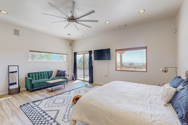 bedroom featuring ceiling fan, wood-type flooring, and access to outside