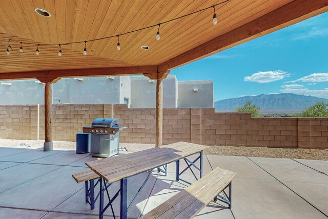 view of patio / terrace with a mountain view and area for grilling