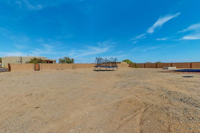 view of yard featuring a trampoline