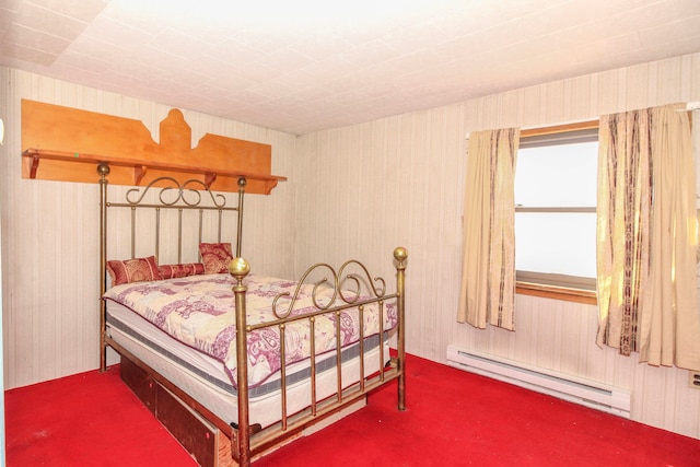 bedroom featuring baseboard heating and carpet flooring