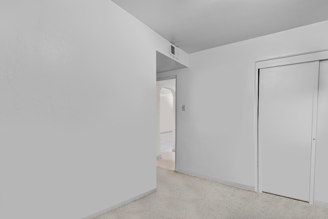 unfurnished bedroom with a closet