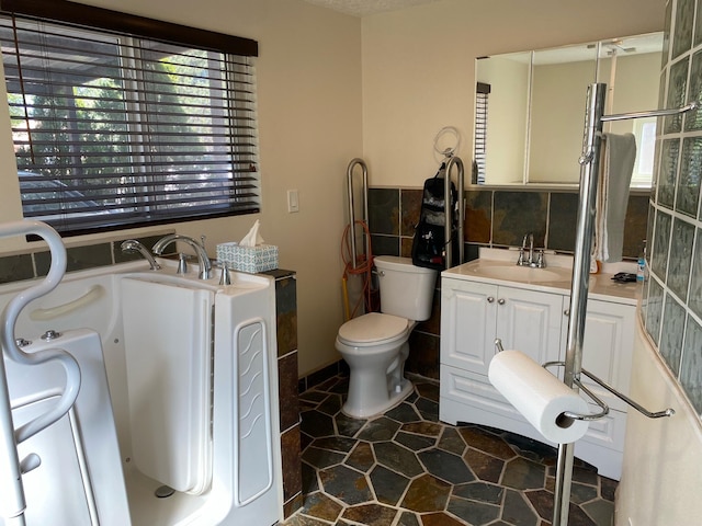 bathroom featuring vanity, toilet, and tile patterned floors