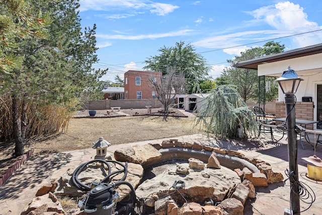 view of patio featuring an outdoor fire pit