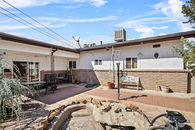 view of patio / terrace with a wooden deck and cooling unit