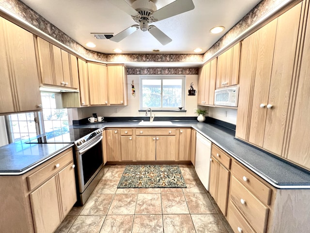 kitchen featuring light tile patterned floors, light brown cabinetry, sink, white appliances, and ceiling fan