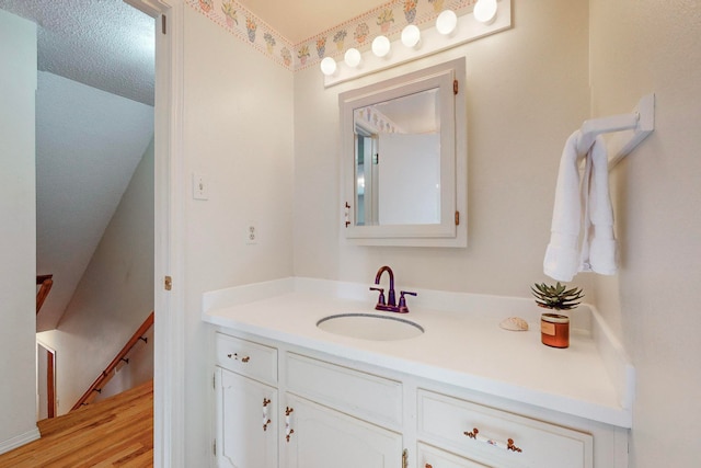 bathroom featuring hardwood / wood-style floors and vanity