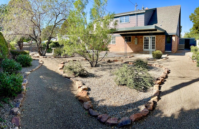 rear view of house featuring french doors and a patio