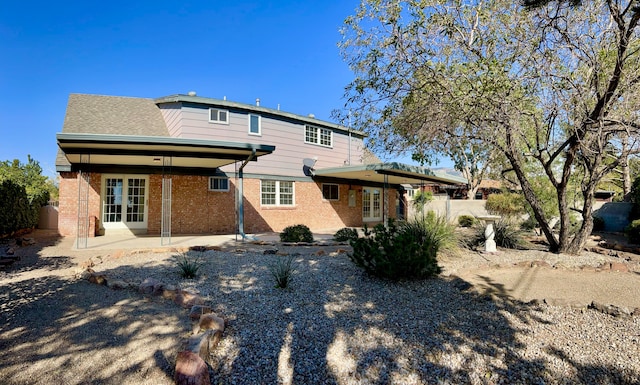 back of house with french doors and a patio area