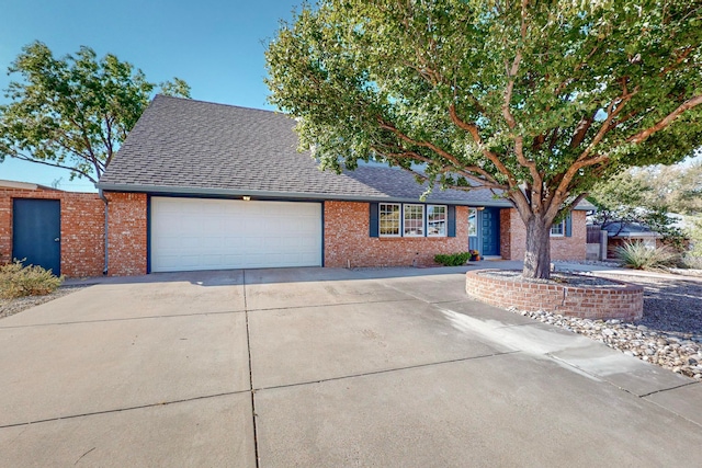 ranch-style house featuring a garage